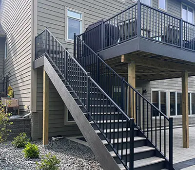 A staircase leads up to a raised deck.